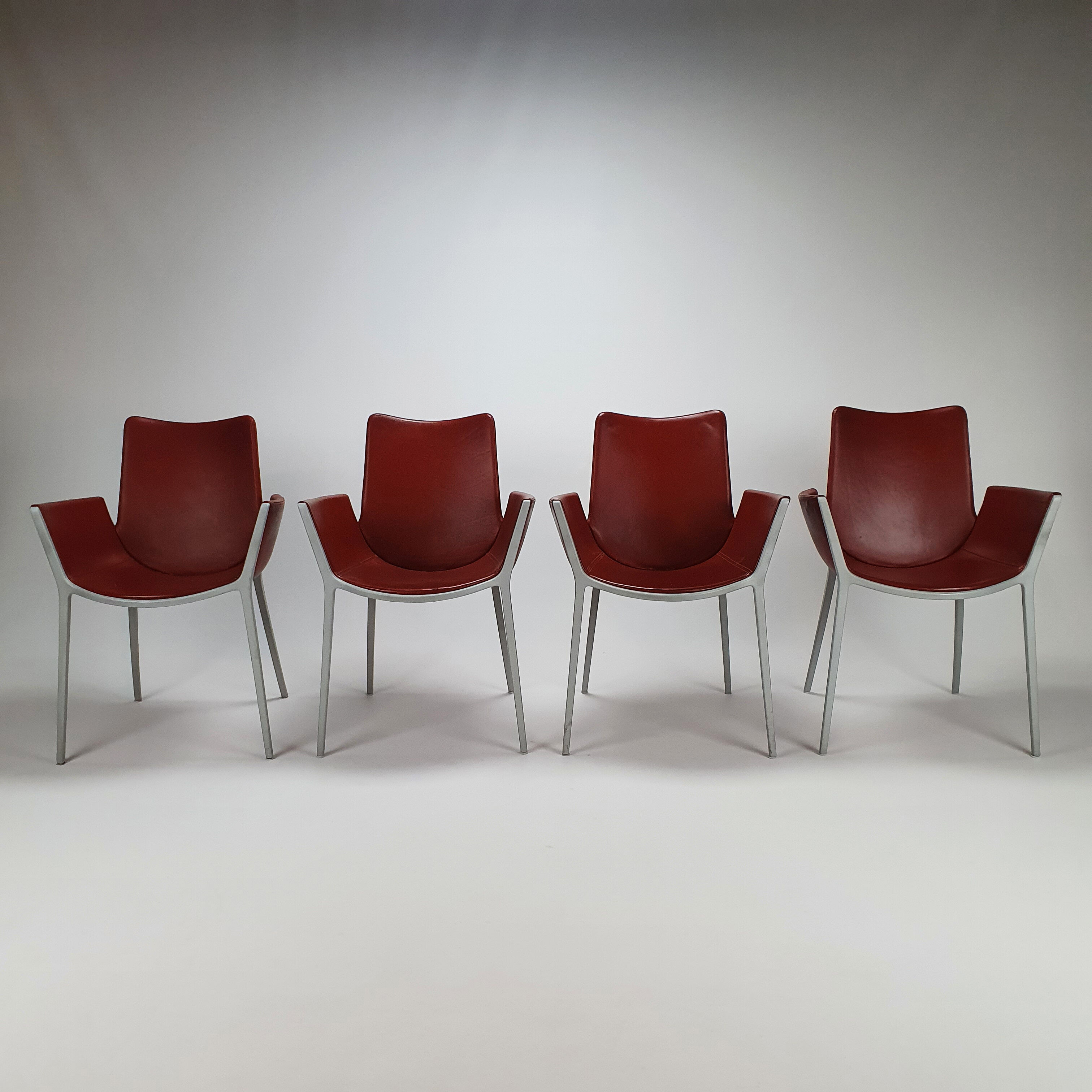 Set of 4 red leather and aluminium duna chairs by Jorge Pensi for Cassina, 1990s