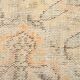 Tapis vintage à décor géométrique orange et crème