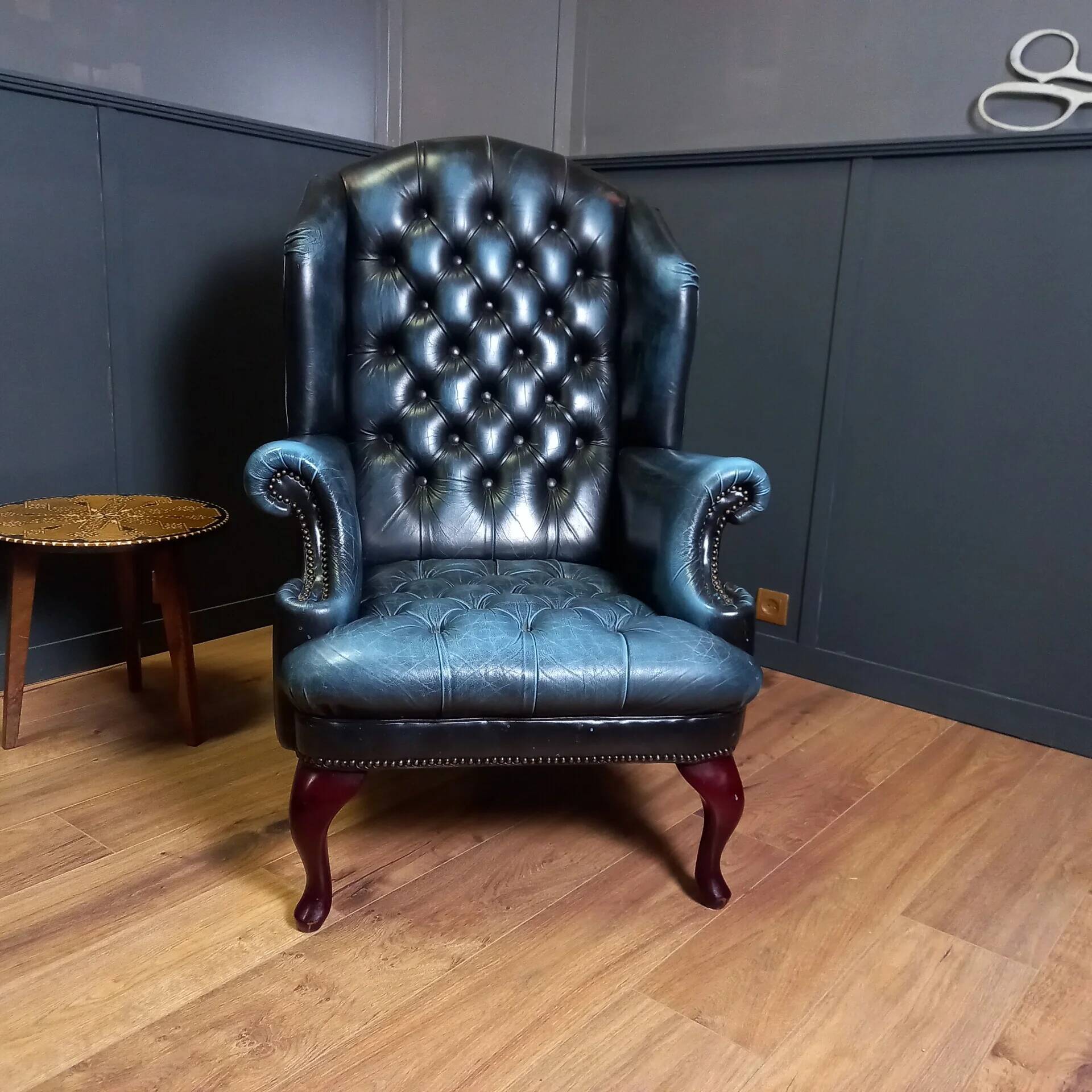 Blue chesterfield barrel back armchair