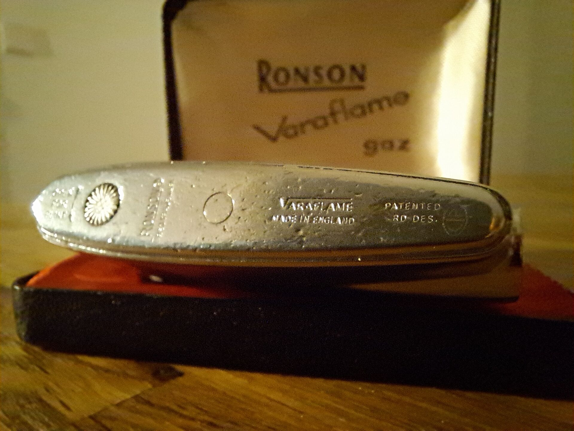 Vintage Ronson Varaflame chrome lighter and its original case.