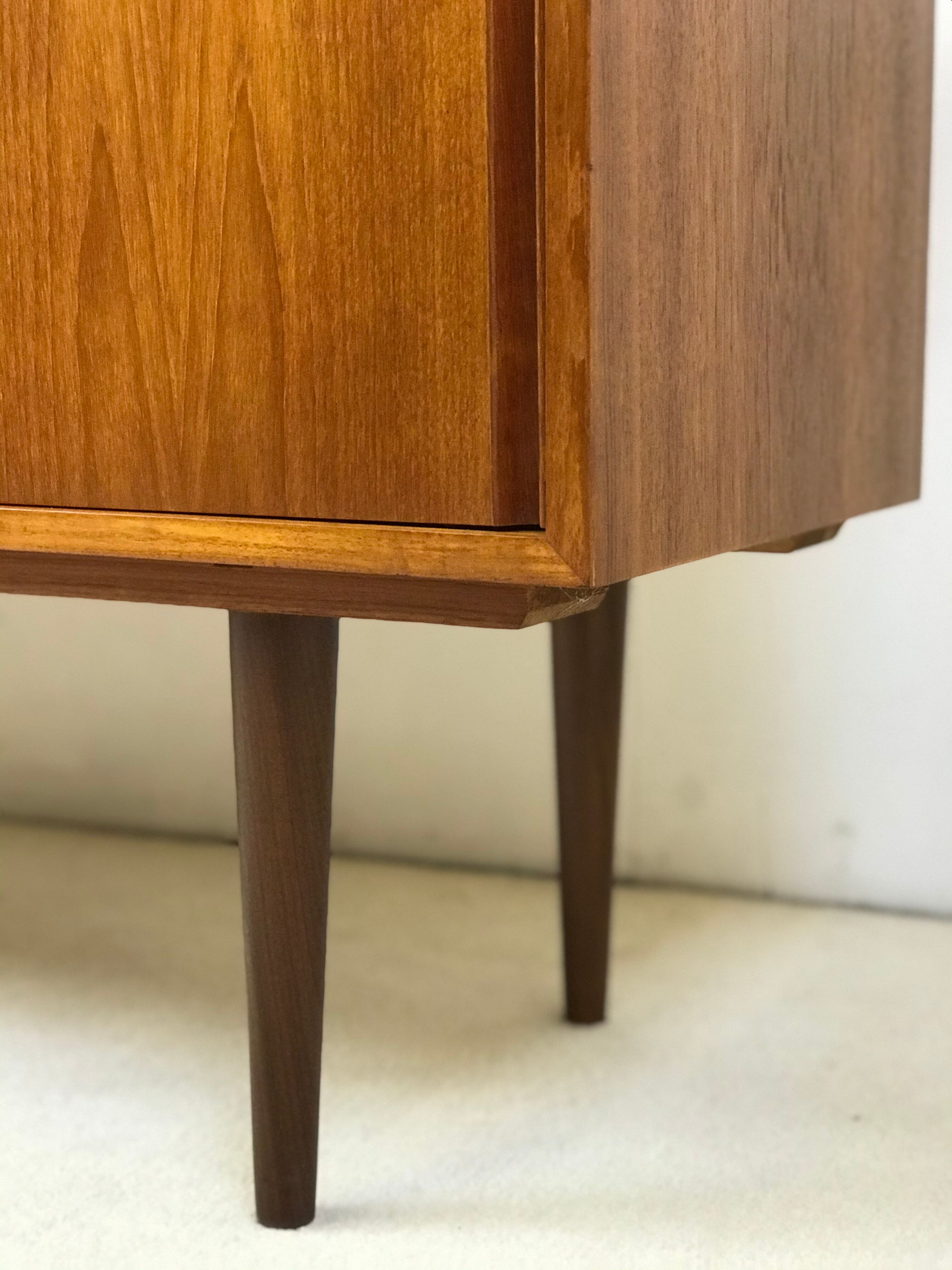 Danish teak sideboard with two sliding doors and 4 central drawers