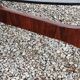 Designer coffee table by Hugues Poignant in rosewood and smoked glass from the 70s