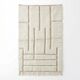 White Moroccan rug with a graphic pattern.
