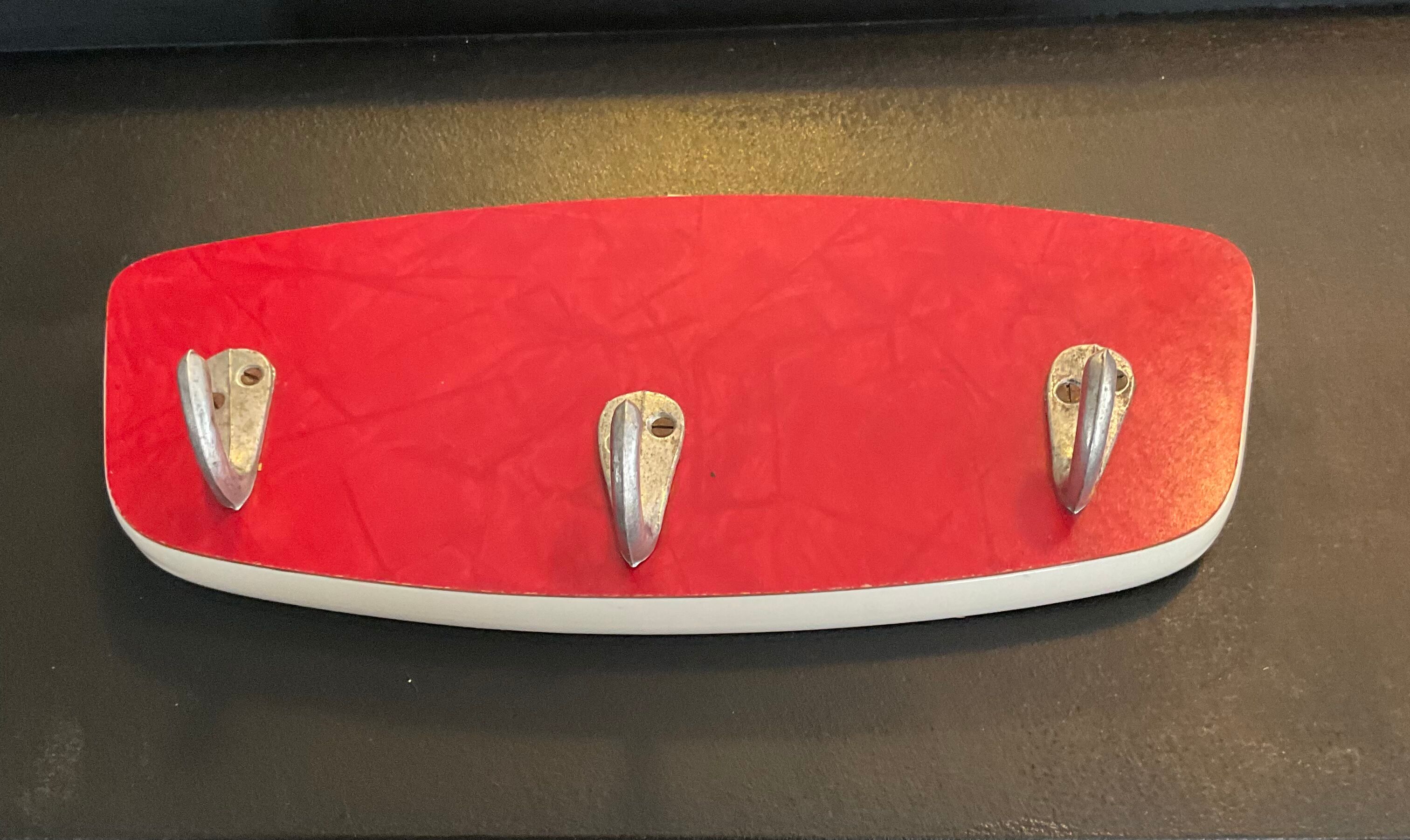 Asymmetrical coat rack of the 60s in formica