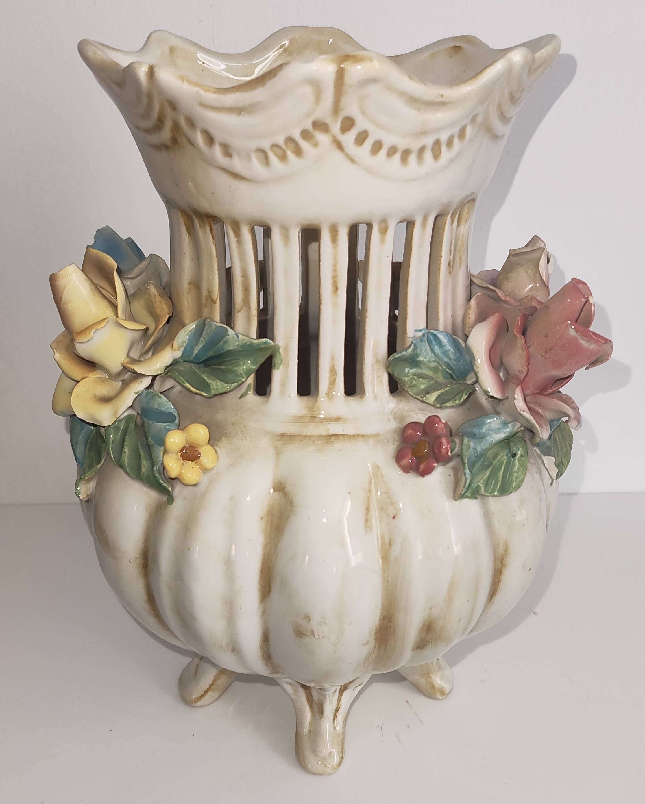 Antique ceramic pot-pourri vase with relief floral decoration.