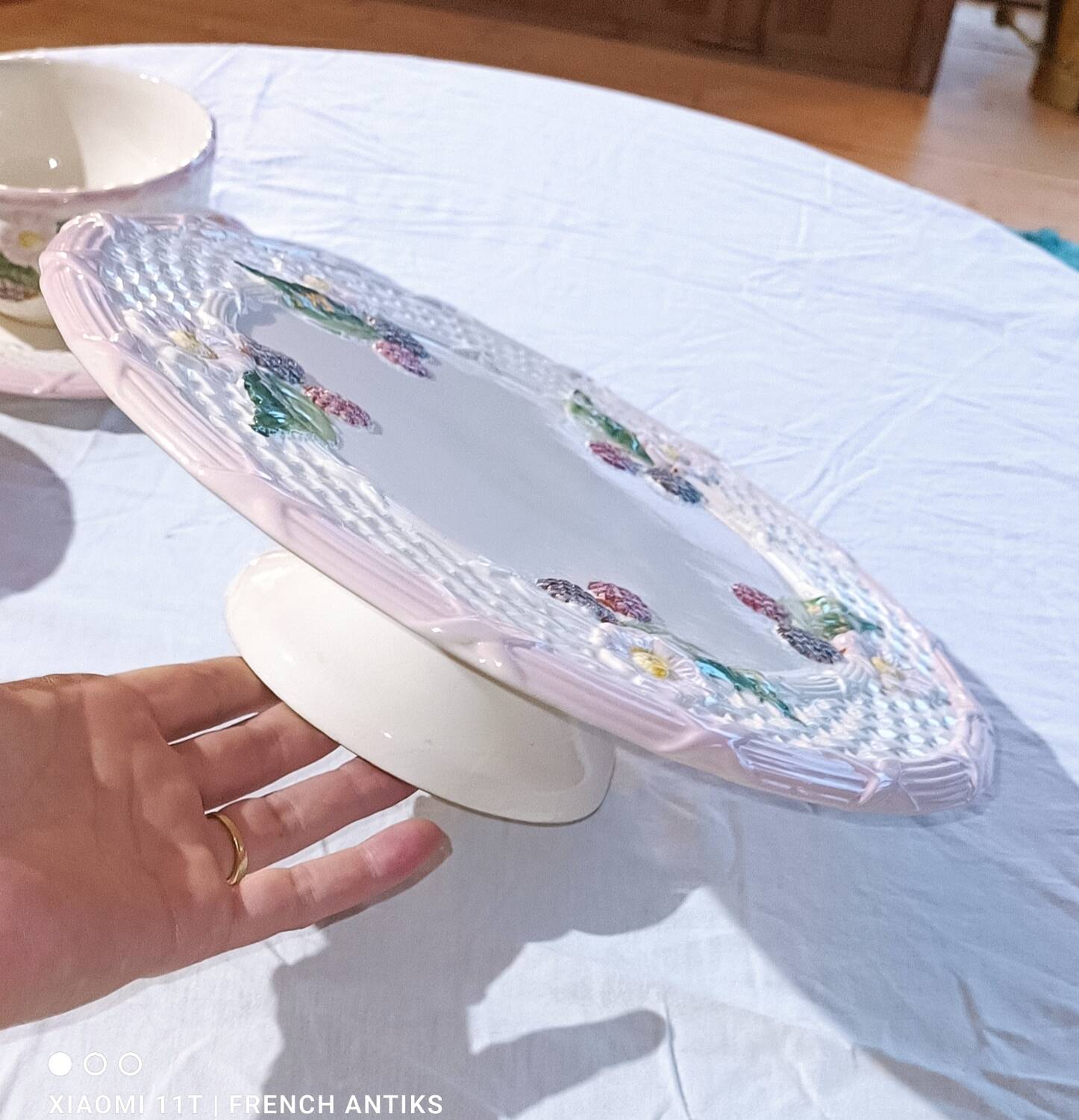 Footed dessert plate in barbotine porcelain, marked FG.