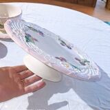 Footed dessert plate in barbotine porcelain, marked FG.