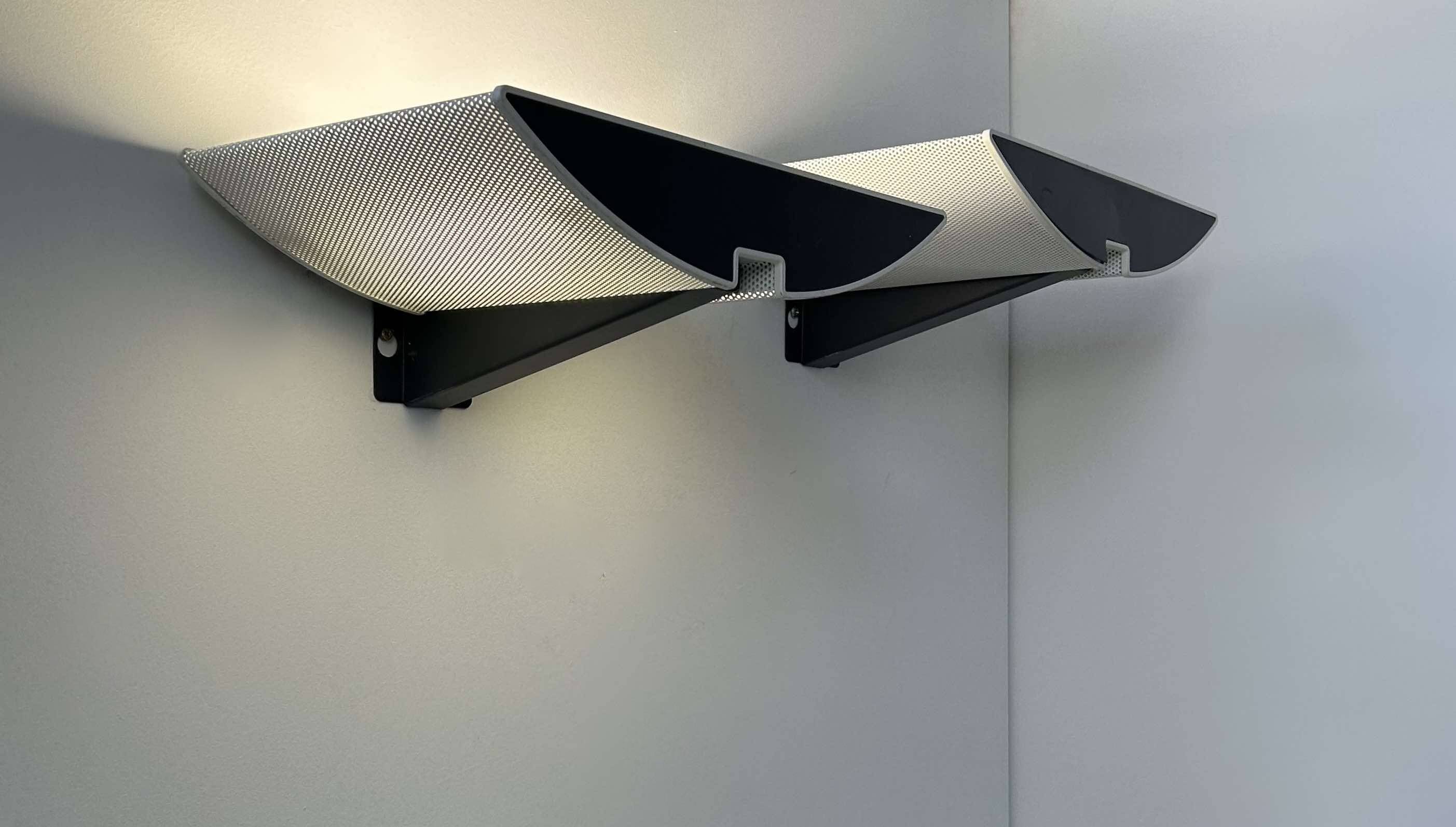 Pair of modernist wall lights, black and white lacquered metal, Italy 1980