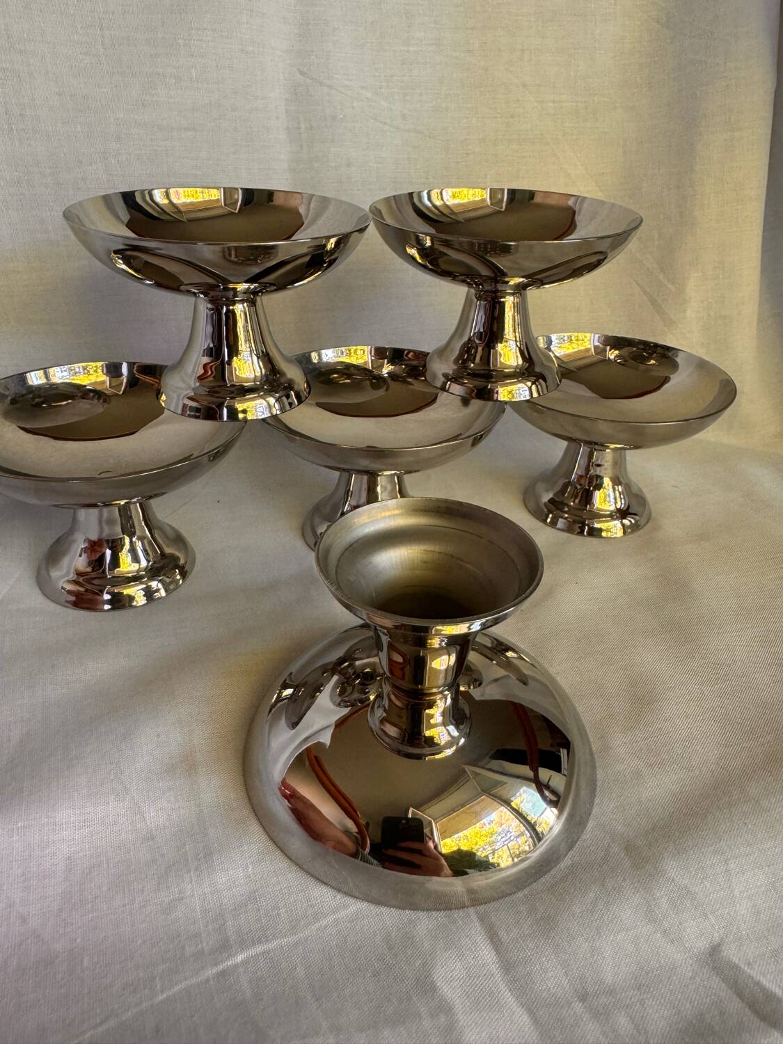 Set of 6 stainless steel ice cream bowls by Guy Degrenne with matching spoons.