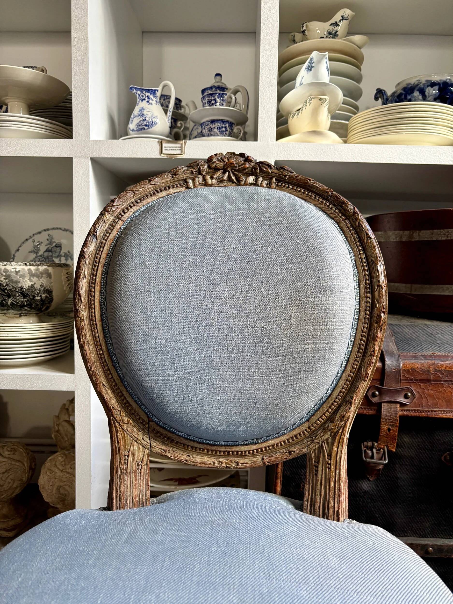 Medallion back chair in reclaimed wood and blue cotton.