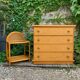 Dresser and its bedside table in cane rattan and vintage oak from the 1970s.