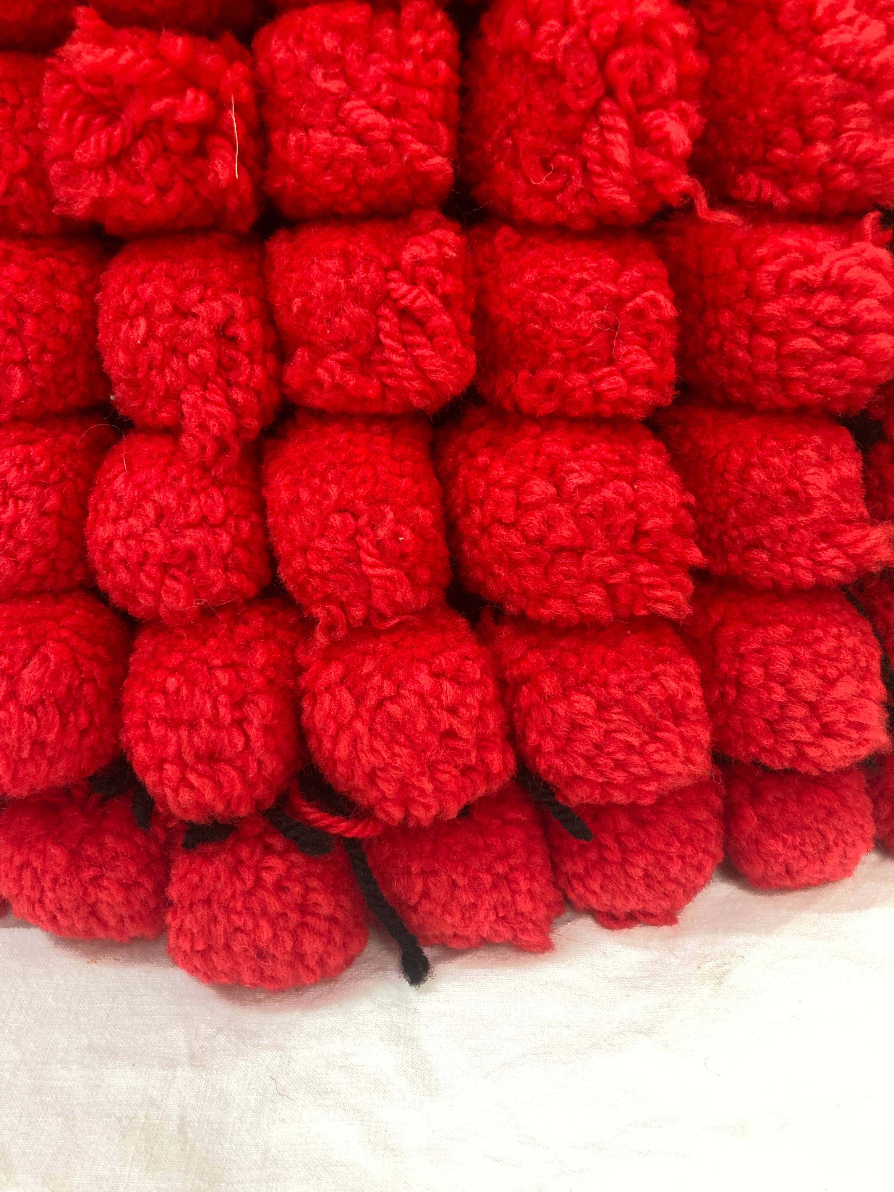 Vintage cushion red pompoms