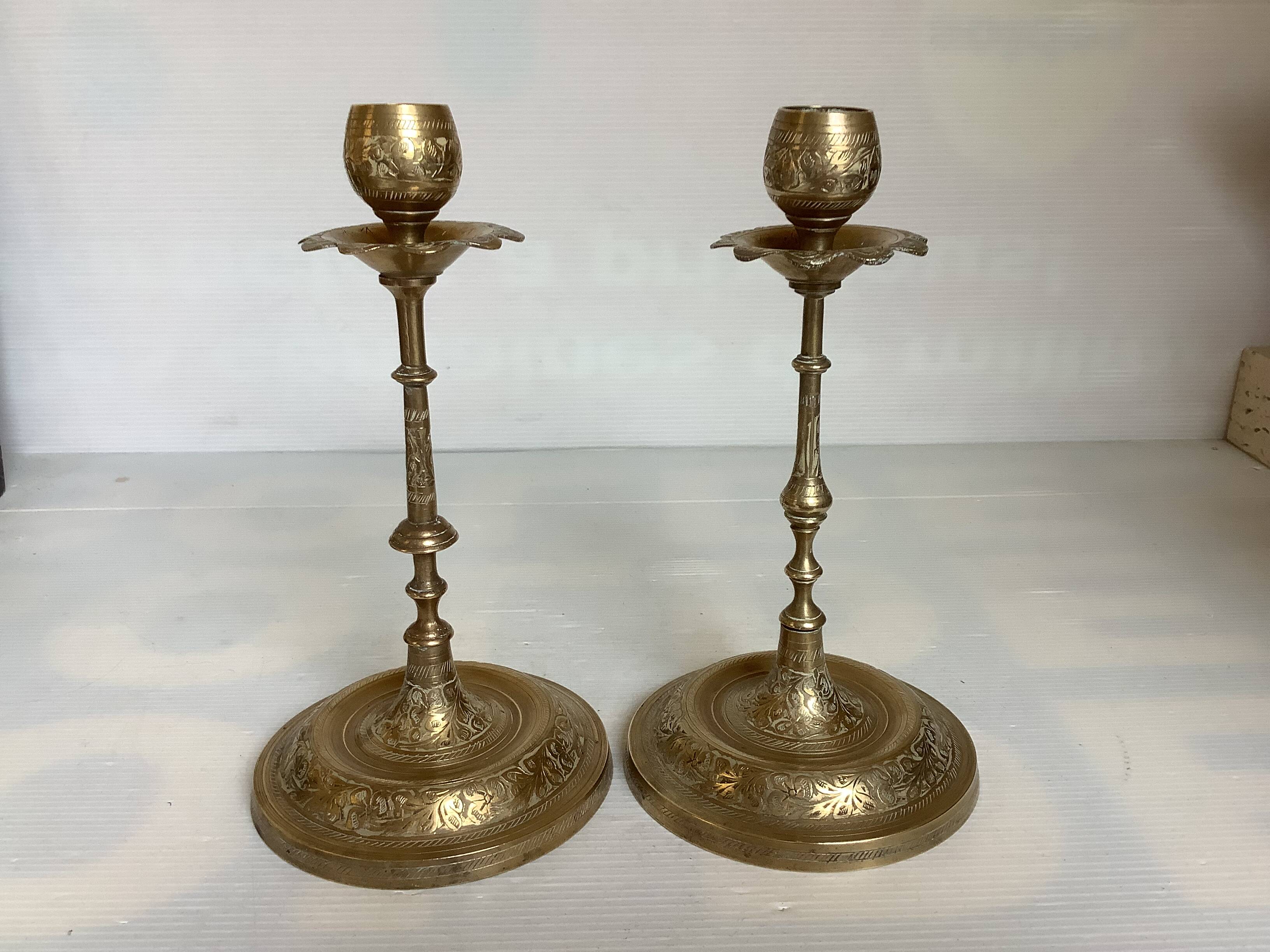 Pair of brass candlesticks with worked flower balls.