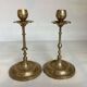 Pair of brass candlesticks with worked flower balls.
