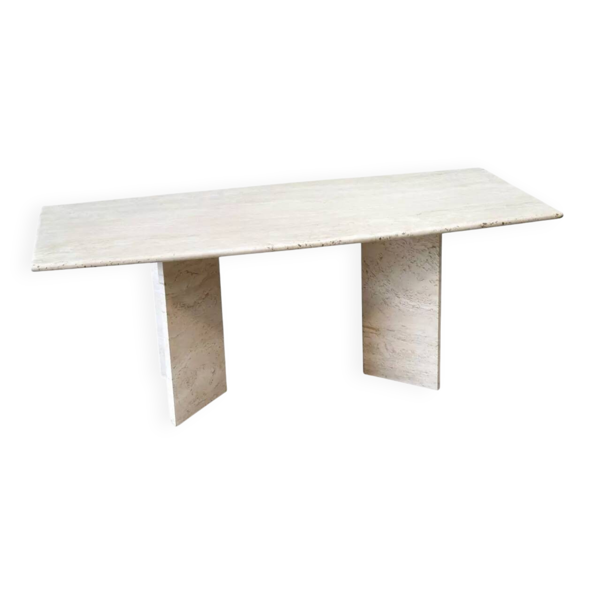 Sculptural travertine dining table