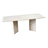 Sculptural travertine dining table