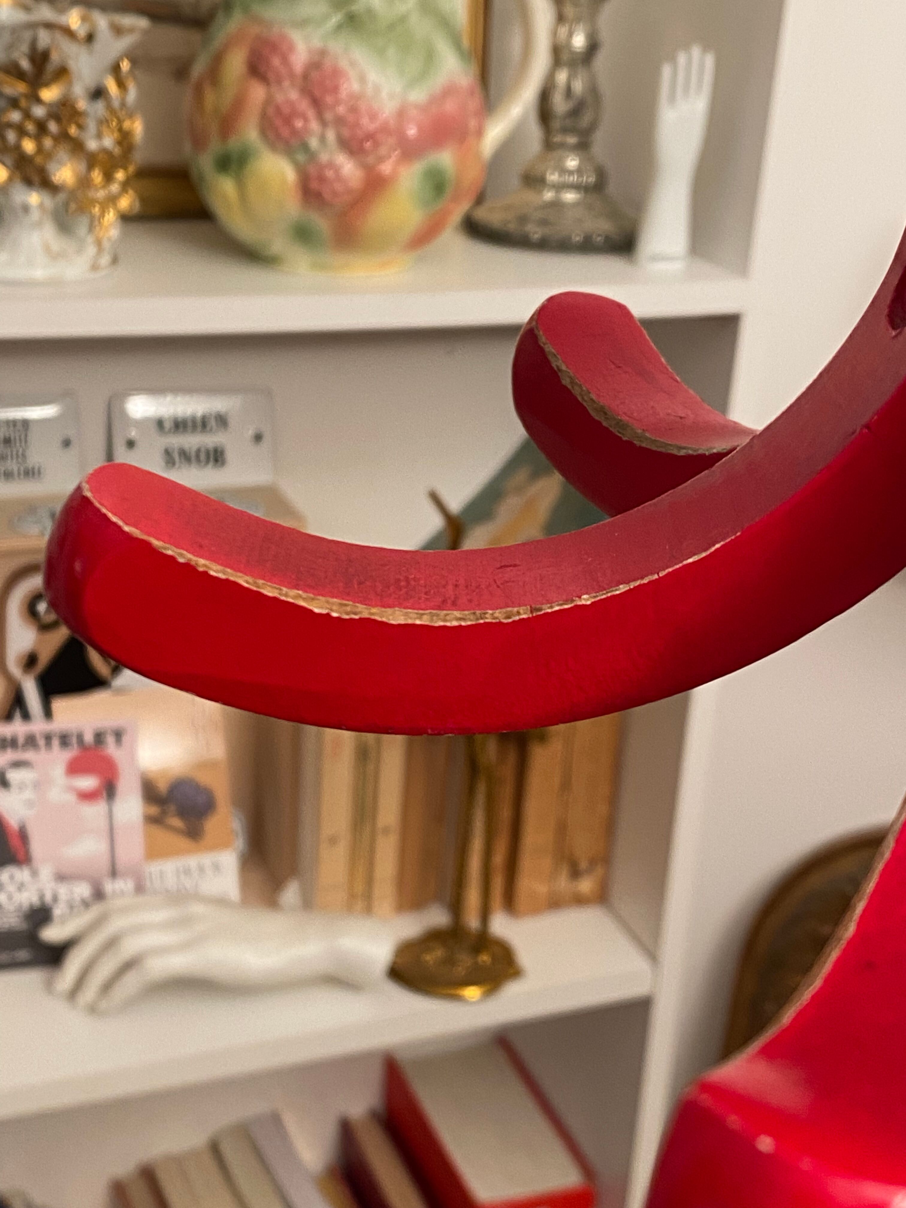 Red Baumann parrot coat rack
