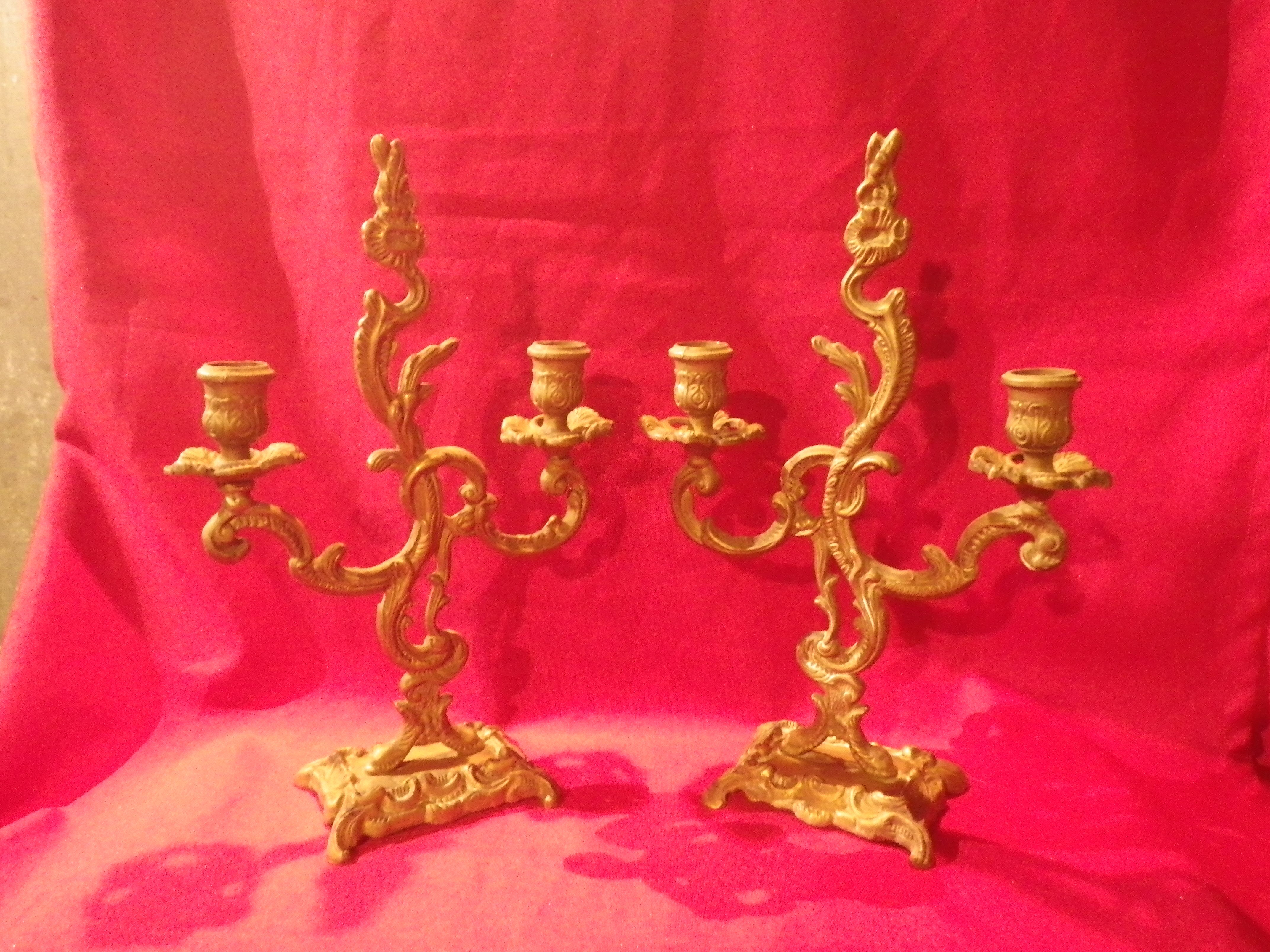 Two brass NCIAN candlesticks
