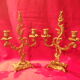 Two brass NCIAN candlesticks