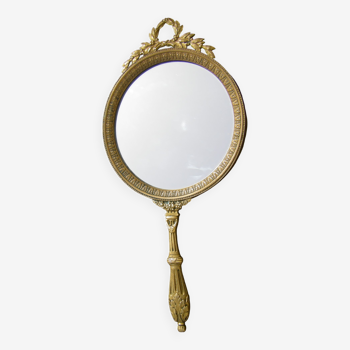 Antique hand-faced mirror in gilded bronze