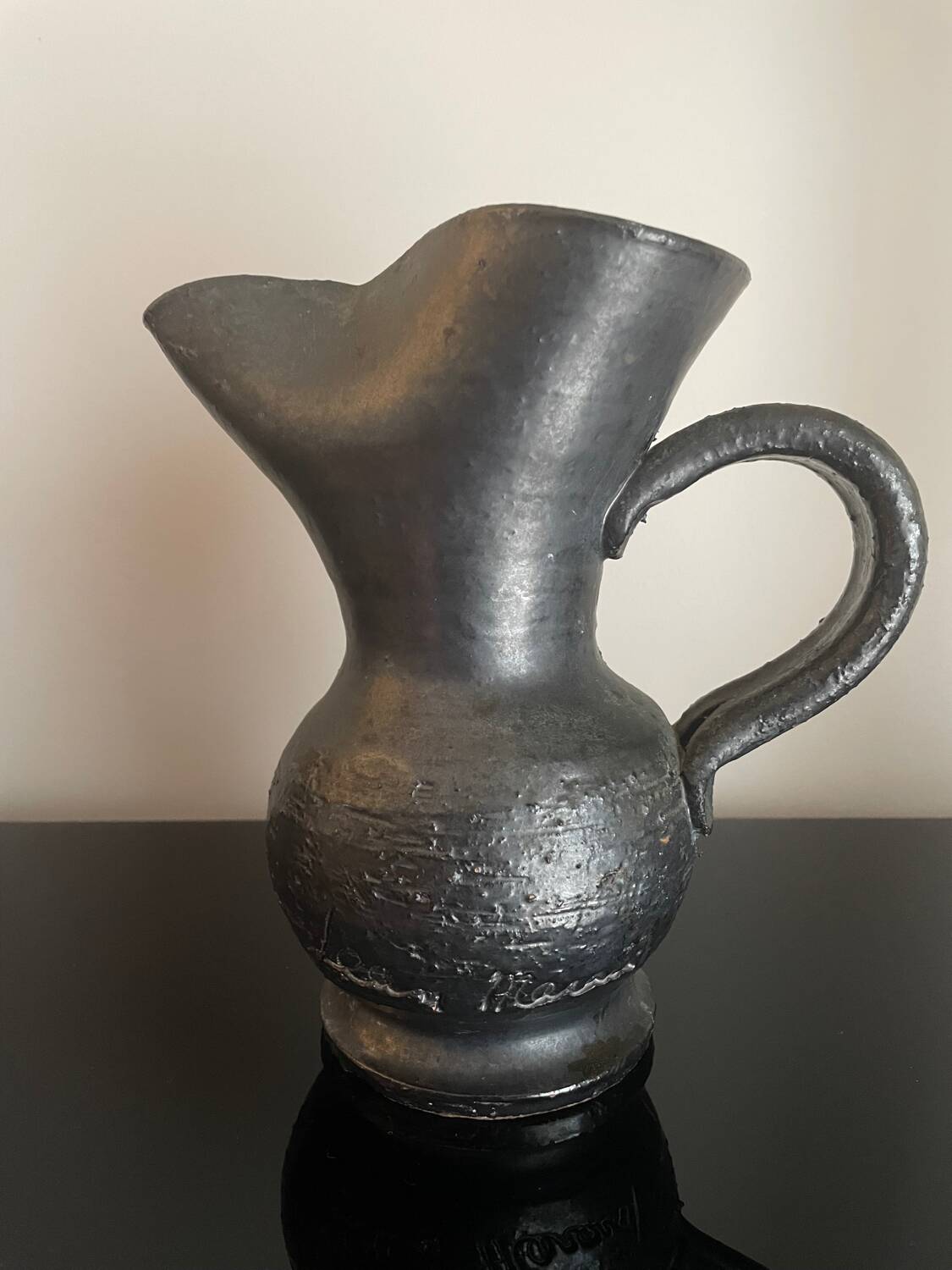 Black ceramic pitcher by Jean Marais
