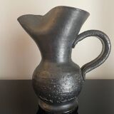 Black ceramic pitcher by Jean Marais