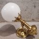 Pair of brass boat swivel appliques - opalin glass globe