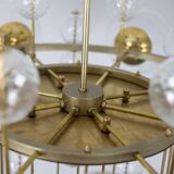 Large chandelier in gilded brass with decorative balls. 1970s.