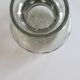 Cracked glass vase encircled with wrought iron.