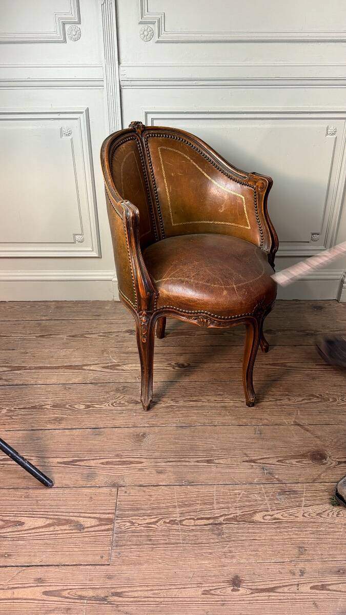 Louis XV style office chair in carved wood, brown leather, circa 1920.