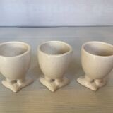 Set of cracked egg cups with feet