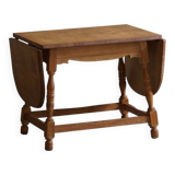 Danish mid-century folding side table in oak, Henning Kjærnulf, 1960s.