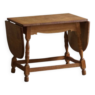 Danish mid-century folding side table in oak, Henning Kjærnulf, 1960s.