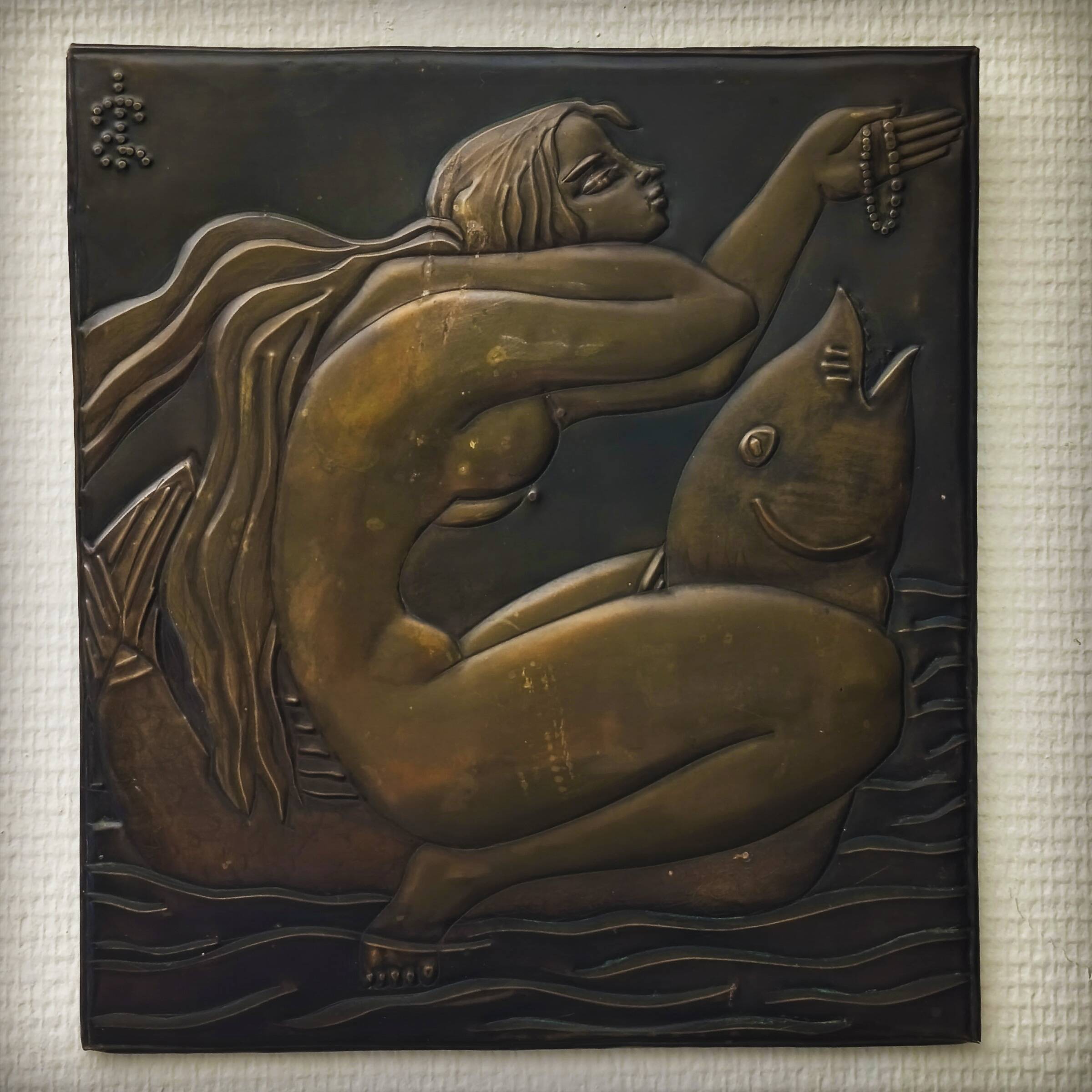 Brass table featuring a woman and a dolphin, France, 1960s.