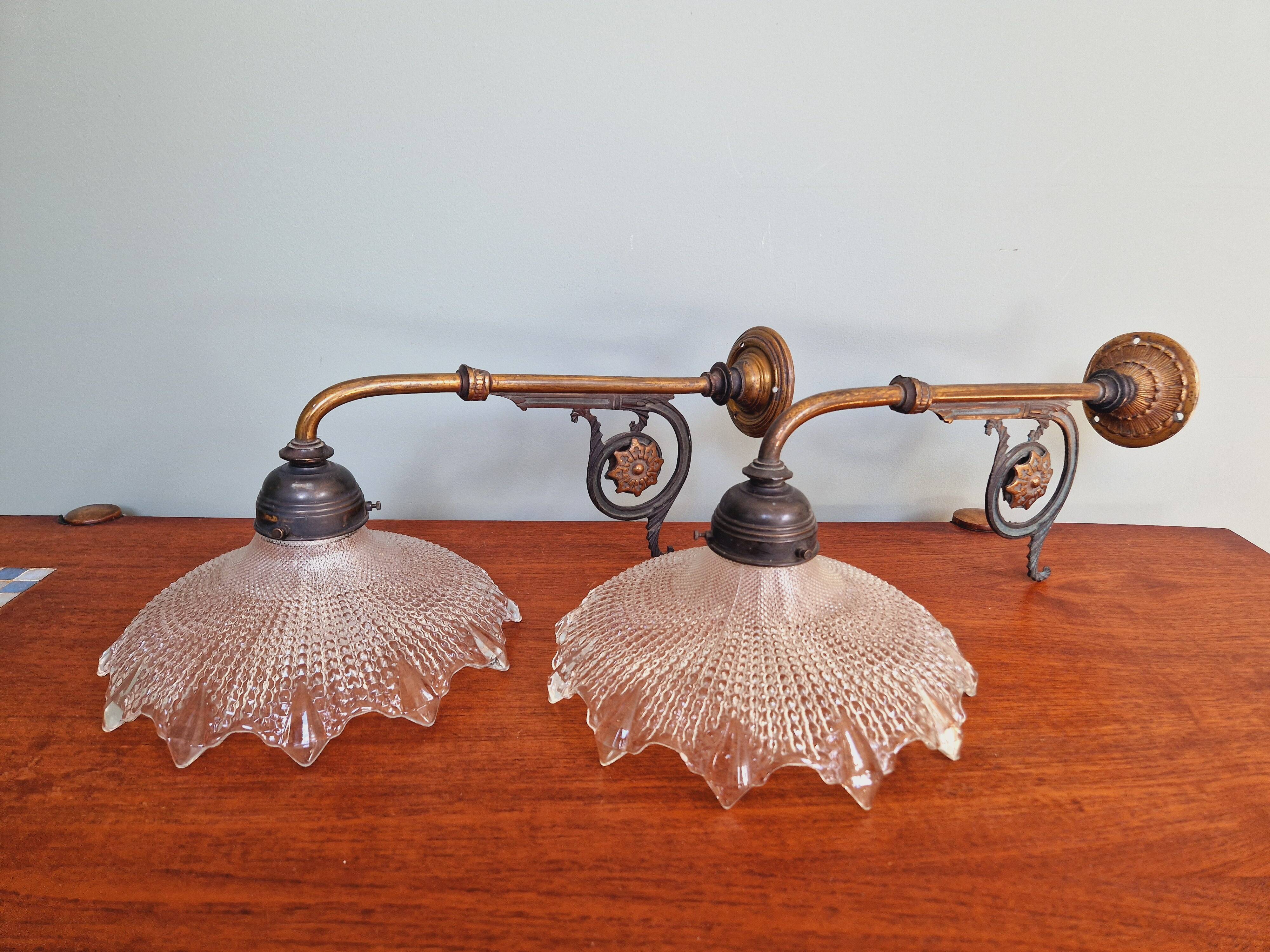 Pair of pendant lights in bronze and scalloped transparent glass