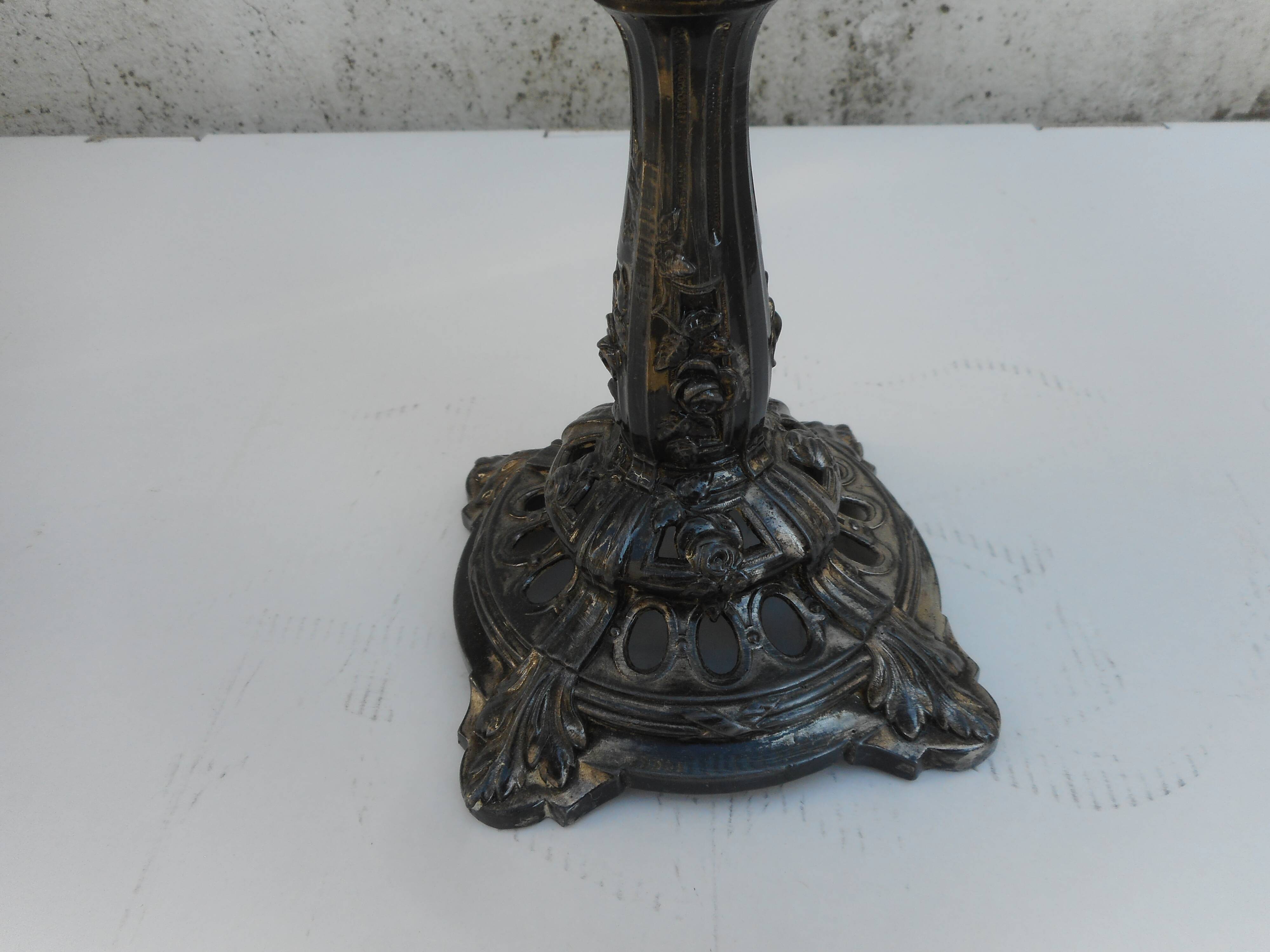 A glass cup on metal stand