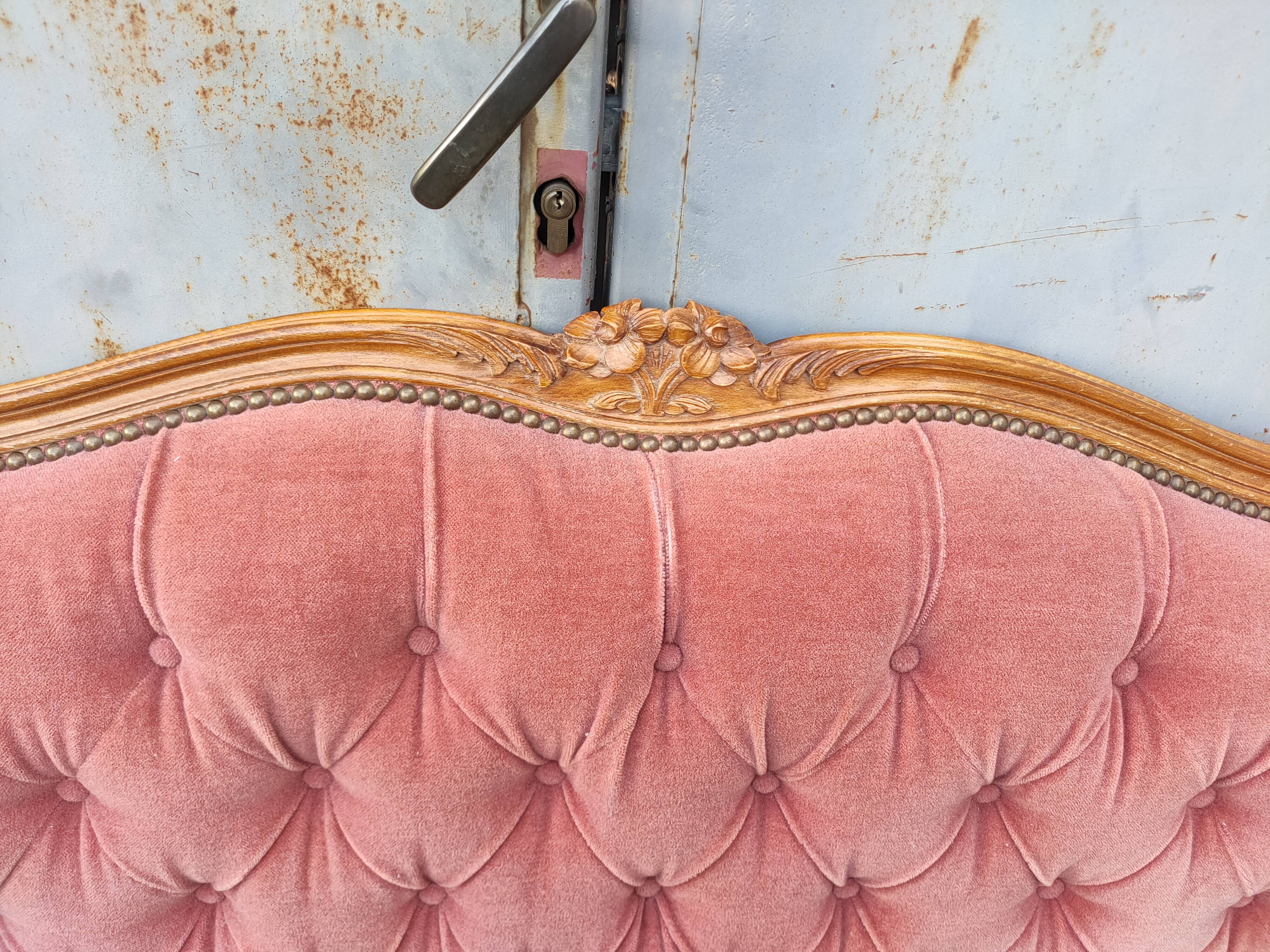 antique wooden and fabric headboard