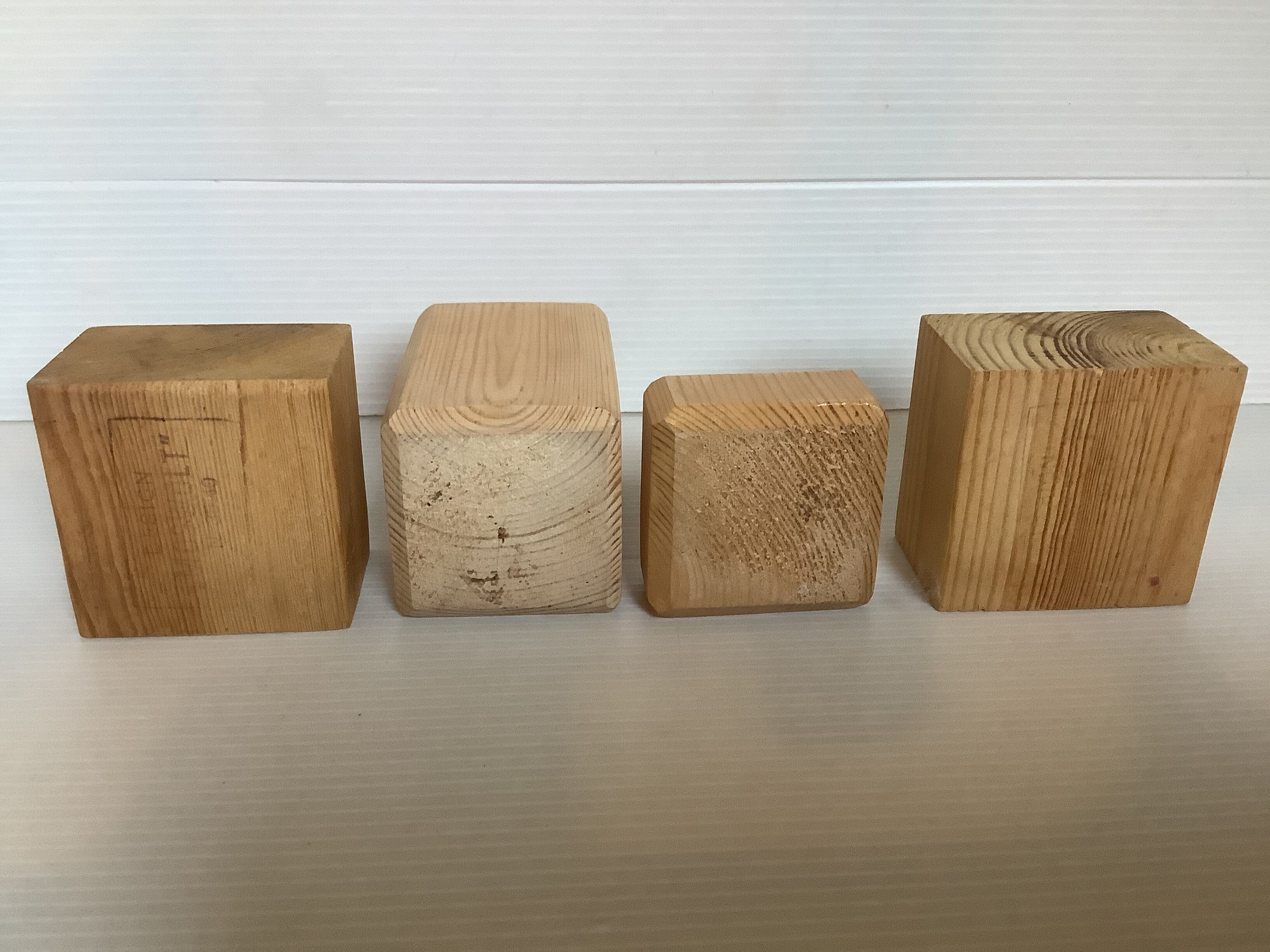 Set of four scandinavian wooden candle holders