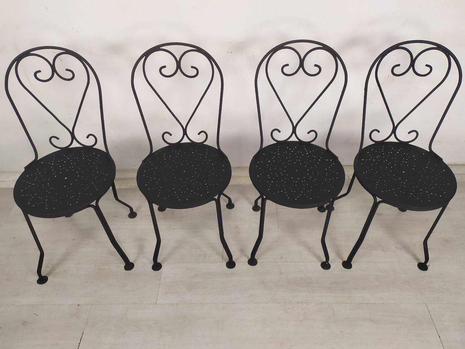 4 black garden chairs
