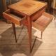 Nightstand with veneer and 4 drawers.