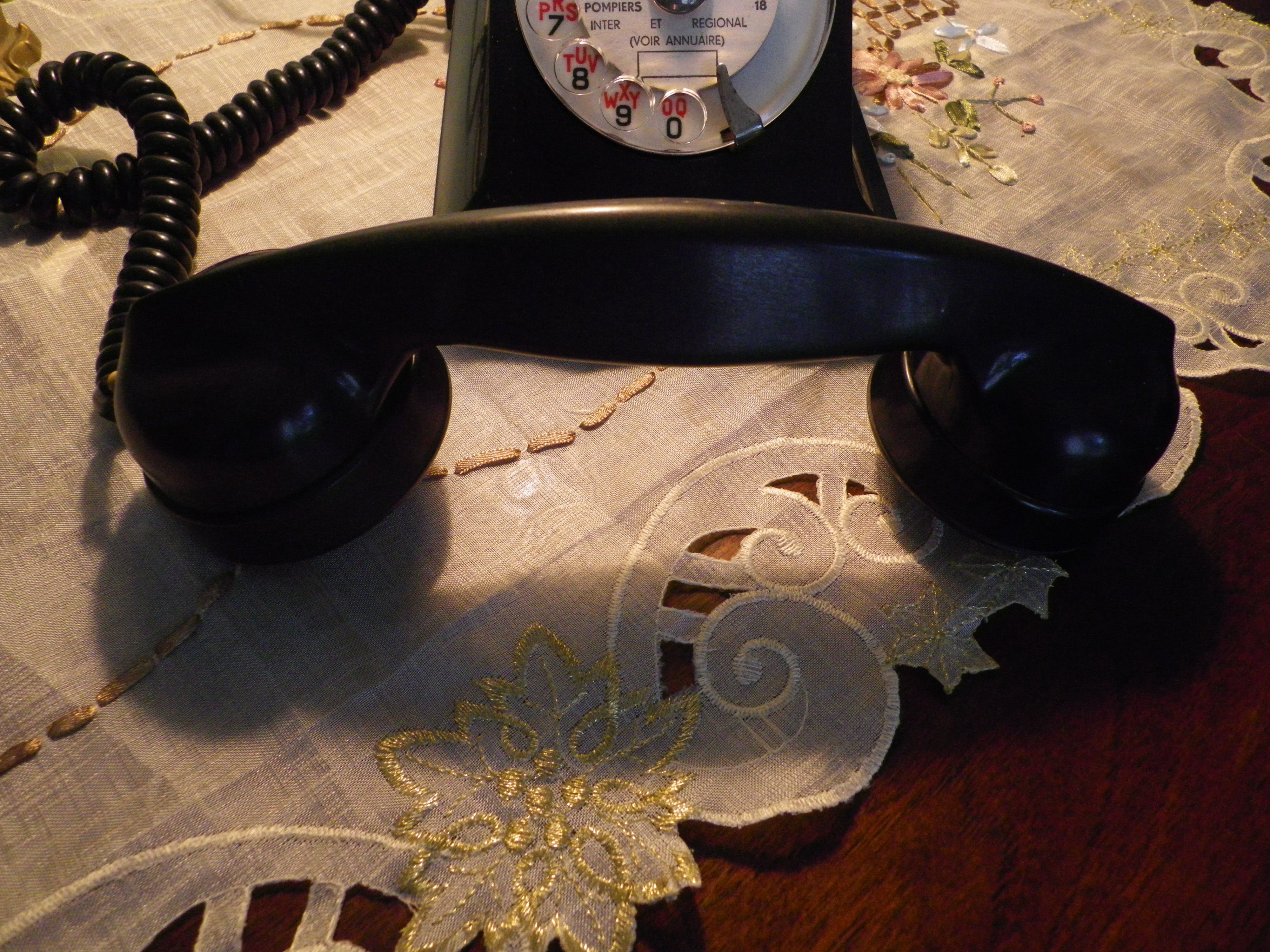 Black bakelite phone with earphone