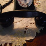 Black bakelite phone with earphone