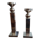 Pair of designer candlesticks in chromed metal.