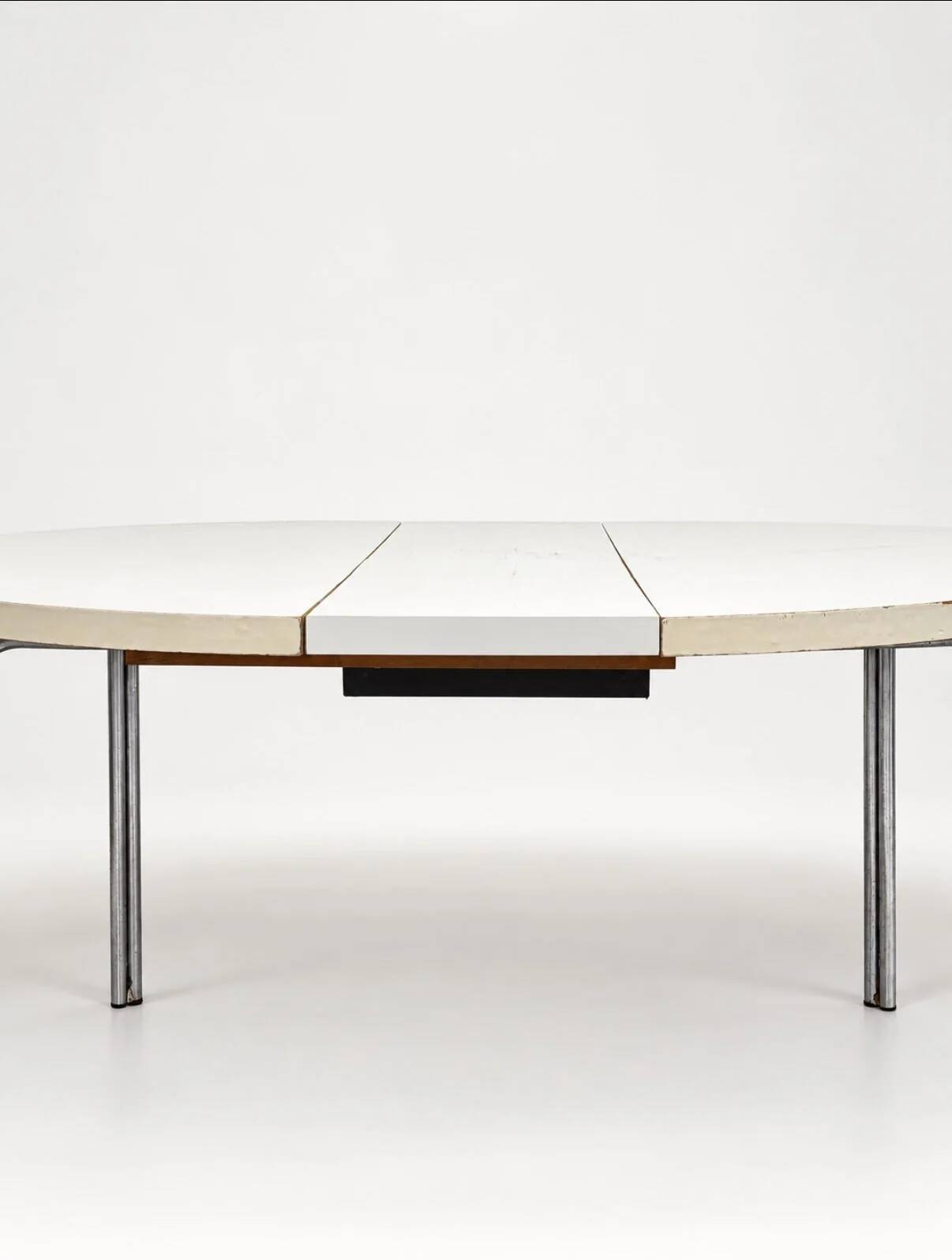 Vintage round extendable dining table, white laminate on chrome legs.