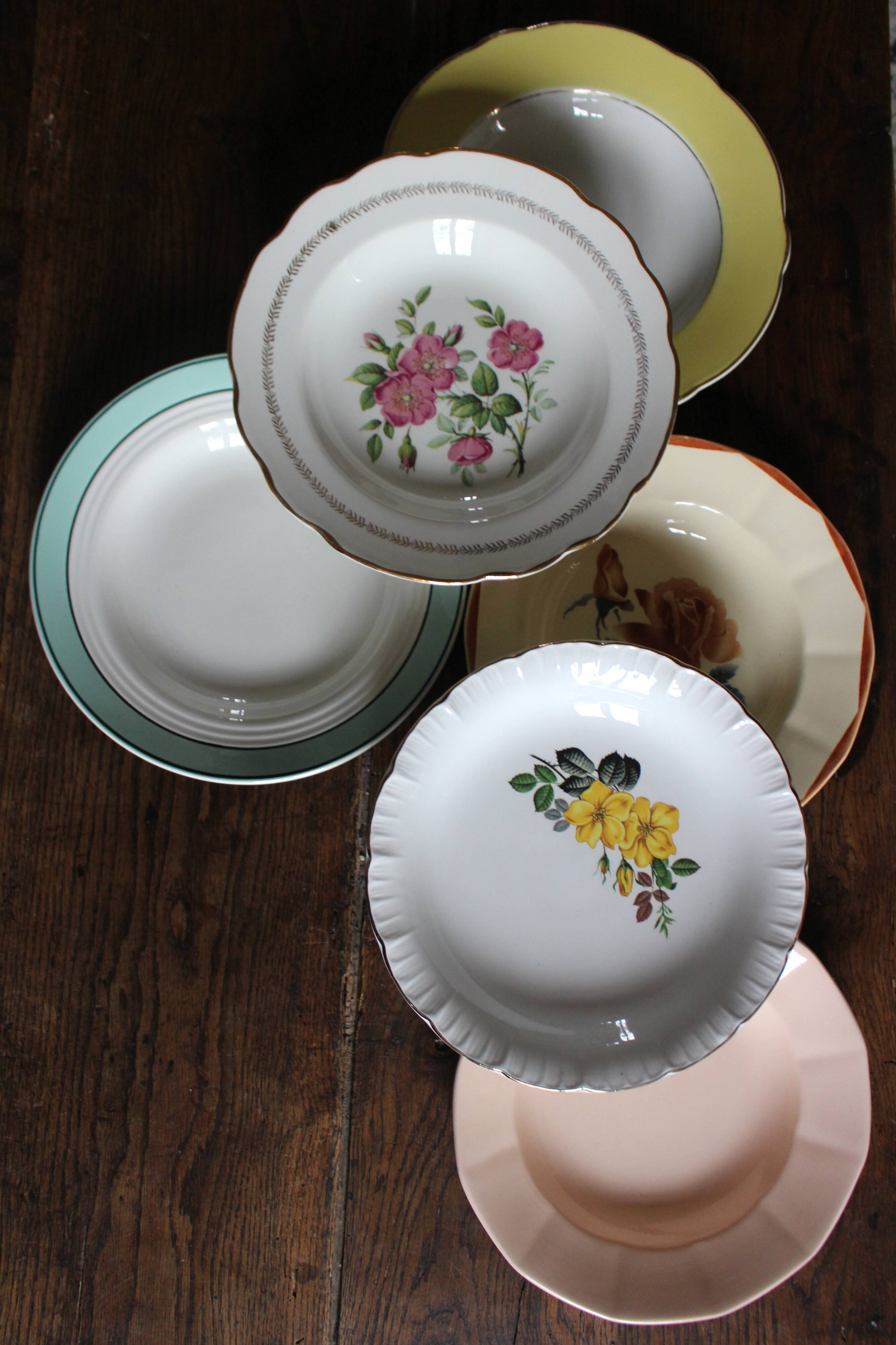 6 mismatched deep plates in floral colours from Digoin, Sarreguemines, Gien.