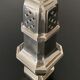 1 silver metal sprinkler