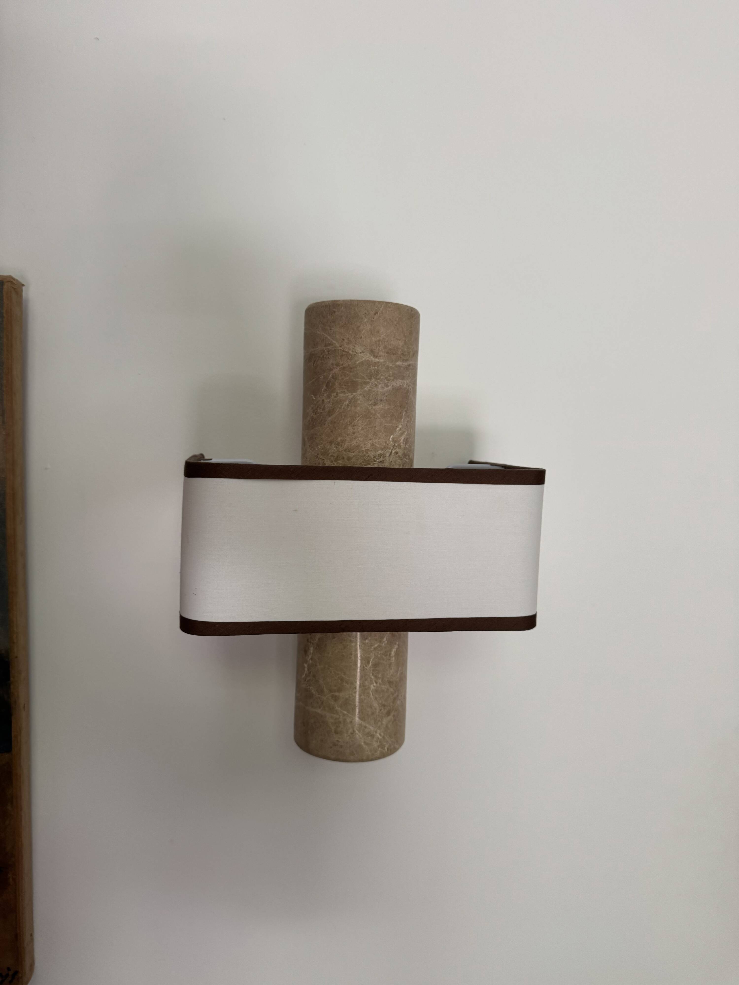 Pair of marble wall lights with fabric shades