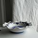 Small hand-painted earthenware salad bowl with garland of blue flowers, mark below