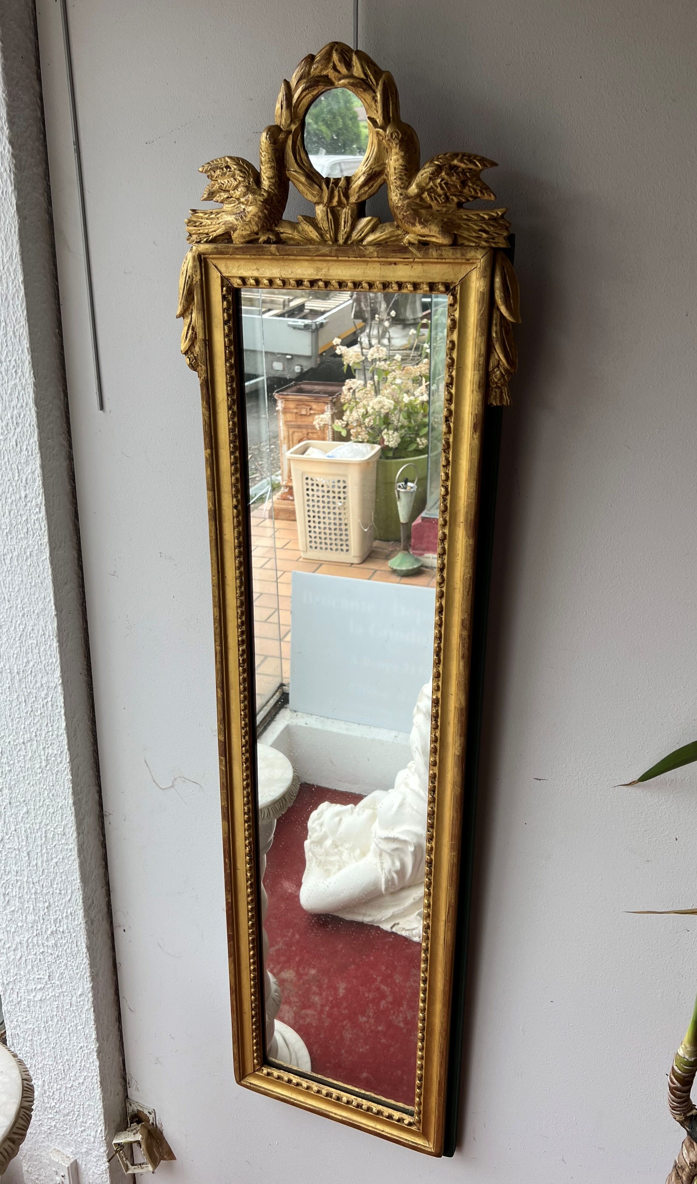 Mirror between two Louis XVI style in gilded wood with leaf around 1900