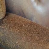 Large and comfortable sheepskin leather wingback chair with black piping